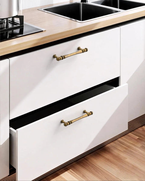 Close-up of kitchen drawers with 10 Pack 3 Inch Antique Brass Cabinet Pulls, Vintage Zinc Alloy Handles For Kitchen Drawers.
