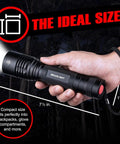 Person holding Ultra Bright 1200 Lumen Tactical Flashlight Handheld for camping and hunting, showing size for easy grip.