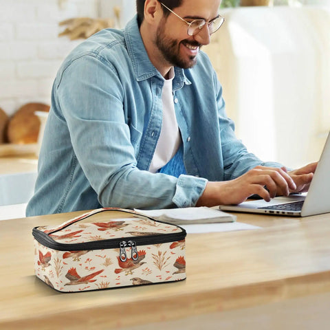 Raptor Inspired Kids Lunch Bag Insulated Tote With Red Tailed Hawk Design on table, man working in background