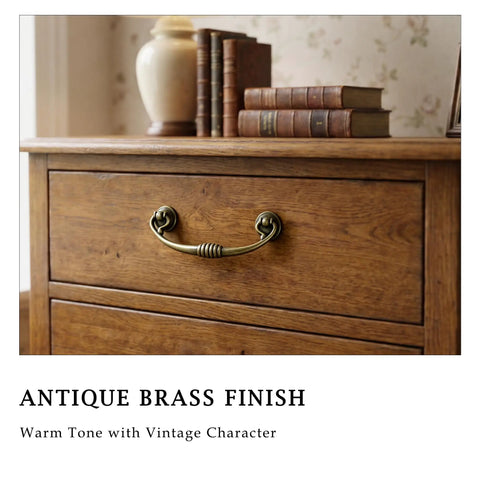 Close-up of drawer with Vintage Bail Drawer Pulls 4 Pack Antique Brass Drop Handles for dresser makeover and restoration.