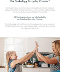 Two women smiling and high-fiving in a kitchen, promoting the Sinkology Everyday Promise for durable home products.