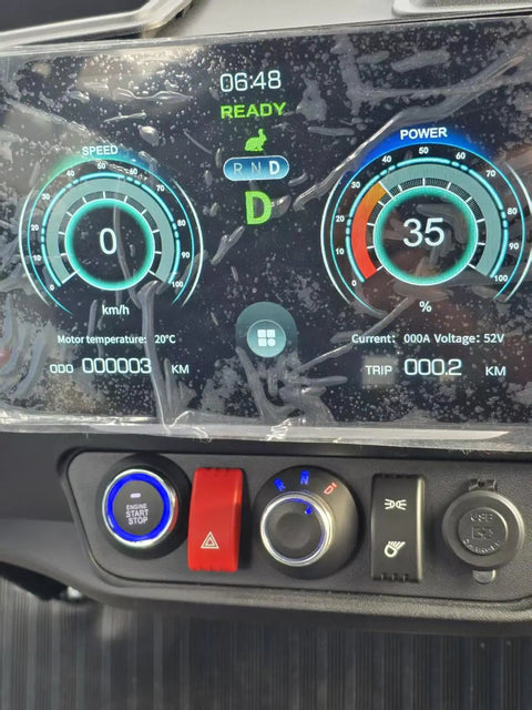 Control panel of the Buttery Smooth 4 Seat Electric Golf Cart With 48V Torque Monster Motor and Premium Stitched Seats displaying speed and power levels.