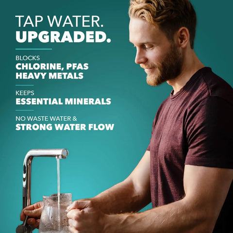 Man filling glass with water from faucet, emphasizing Under Sink Water Filter For Faucet With 20,000 Gallons Or 2 Year Filtration Life Reduces PFAs PFOS Lead And Chlorine Improves Tap Water Taste High Performance NSF 42 And 372 Certified Great Value For Your Kitchen.