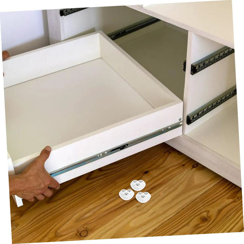 Image showing Eight Piece Stainless Steel Self Adhesive Caster Wheels for furniture relocation with a drawer being installed.