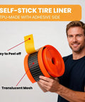 Man holding Self Adhesive Bike Tire Liners TPU Material With Translucent Mesh Orange Lightweight for Mountain and Road Bikes