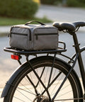 Heavy Duty Steel Rear Bike Rack For E-Bike Mounting Holes 24.5 Cm Adds Luggage Space To Your Steed With Secure Fit And Durable Build. rear view with gray bag