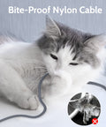 Cat playing with Cat 7 Ethernet Cable 6.6 Ft Flat Nylon Braided Shielded RJ45 LAN Wire, demonstrating bite-proof feature.