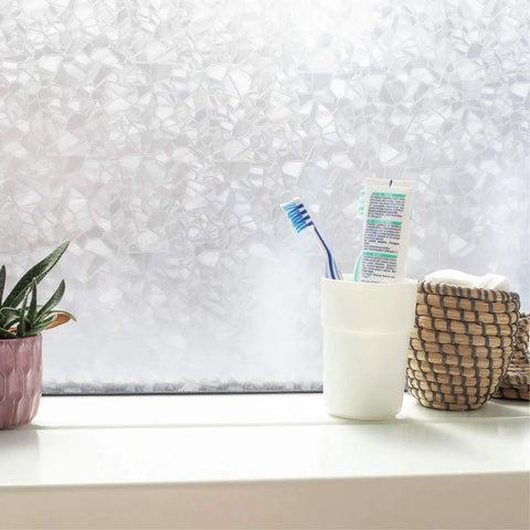 Self Adhesive Privacy Glass Window Film For Windows Doors Showers And Glass Surfaces Seventeen By Seventy Eight Inch Roll No Sweat Easy Peel And Stick With Adjustable Privacy Levels For Any Space installed on window with toiletries on sill