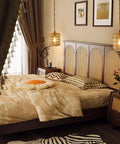 Handcrafted Boho Rattan Plug In Pendant Light With Six Watt Led Bulb And Warm 3000k Glow Featuring A Handy Dimmer Switch Plus Fifteen Foot Cord Easy Peasy Setup And Total Vibe Upgrade For Bedroom illuminating a cozy bedroom with decorative headboard.