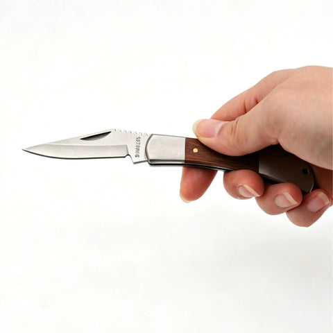 Hand holding Stainless Steel Foldable Knife With Wood Handle And Locking Blade For Hiking And Camping Ultra Portable And Easy To Carry
