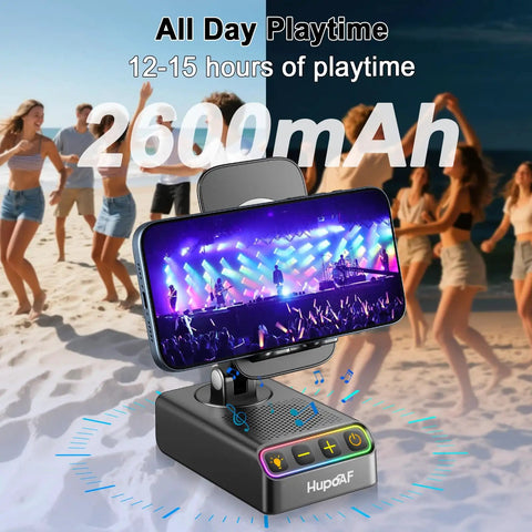 Go To All In One Adjustable Phone Stand with Wireless Induction Bluetooth Speaker showing concert video, beach background.