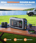 All In One Car Jump Starter With Air Compressor And Tire Inflator on table, charging devices by a lake