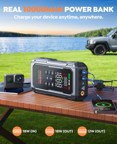 All In One Car Jump Starter With Air Compressor And Tire Inflator on table, charging devices by a lake