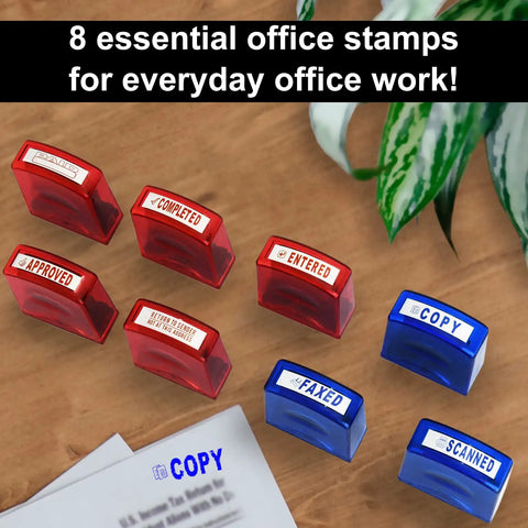 Top Tier Self Inking Office Stamp Set With Eight Gotta Have Rubber Phrases Like Paid And Approved arranged on a desk.