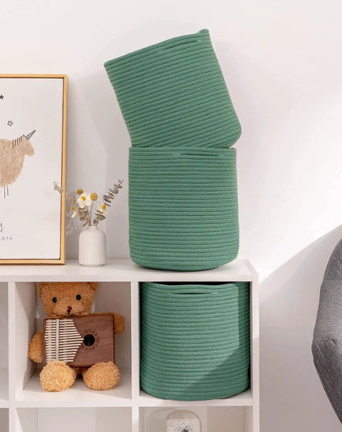 Round 11 Inch Storage Bins Set For Shelves, Durable Woven Cotton Cube Baskets in green displayed on white shelves