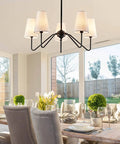 Totally Chic Modern Farmhouse Small Chandelier In Black Finish in dining room over table, perfect light fixture for easy install ceiling mount.