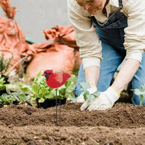 Gardener planting near Simulated Bird Shaped Soil Moisture Sensor With Automatic Alarm Portable Plant Water Tester