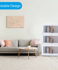 Built Tough Plastic Storage Bins With Lids 3 Pack Of Rock Solid Stackable Collapsible Containers With Clear Front Doors And Handy Roll Out Wheels For Closet Organization And Everyday Living stacked in a modern living room.