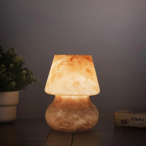 Glass Mushroom LED Bedside Lamp For Bedroom And Living Room on nightstand with warm glow, hand-blown orange glass mood lamp