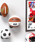 Two Pack Wall Mount Basketball Racks Black Space Saving Ball Holder For Home Gym securely holding footballs and basketball on wall