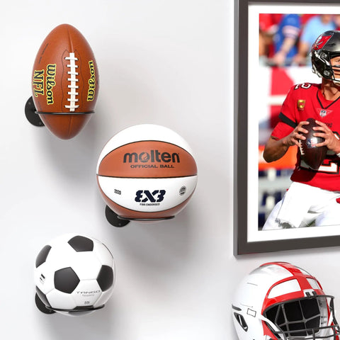 Two Pack Wall Mount Basketball Racks Black Space Saving Ball Holder For Home Gym securely holding footballs and basketball on wall