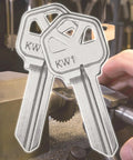Premium Copper Key Blanks Pack Of 50 For Locksmiths And DIY Projects with KW1 marking being crafted.