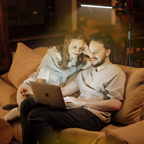 Couple using laptop under Bright LED Floor Lamp With Adjustable Gooseneck For Eyelash Extensions And Tattooing, salon-grade brightness