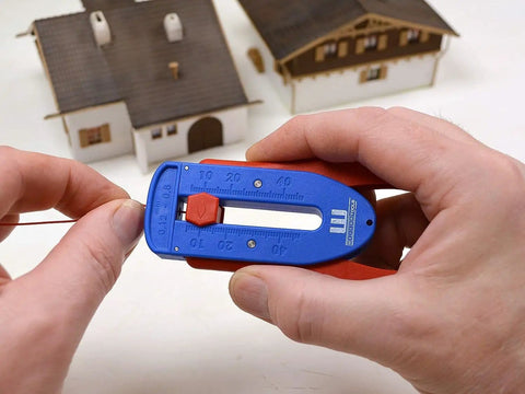 Person using Precision Wire Stripper S Built For Righties And Lefties With Infinitely Adjustable Stripping Range From 0.12 mm To 0.8 mm