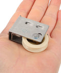 Heavy Duty Guide Pulley Roller Replacement Wheel For Sliding Barn Doors And Cabinets Featuring Rock Solid Construction And Smooth As Butter Silent Glide Action in hand.