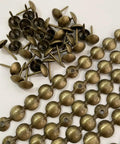 Close-up of Brass Nailhead Upholstery Strips Kit for Sofas Headboards and Benches, 9.5mm brass tacks, 10 strips total 10 meters