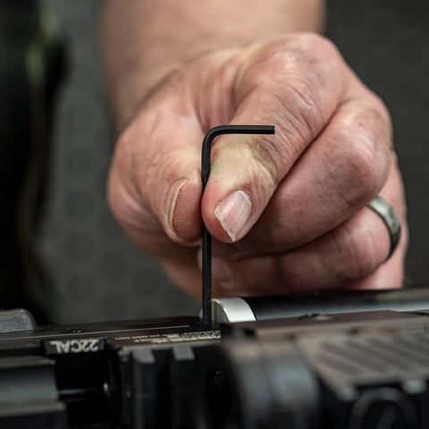 Person using an Allen wrench on airgun for Airgun Maintenance And Cleaning Kit With Silicone Lubricant And Portable Case