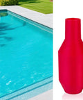 Hands-Off Manual Siphon Pump That Gets The Job Done Fast next to a swimming pool, red, plastic material, used for water transfer.