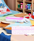 No Sweat Cordless Electric Scissors That Slays Through Heavy Fabric And Leather With Ergonomic Handle And Safety Guard For Reliable Sewing And Workshop Upgrades Now on a cutting table with fabric scraps.