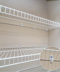 White Wire Shelf Brackets With Mounting Hardware Heavy Duty Closet Clips Built Tough For Pantry And Garage Storage installed on shelves.