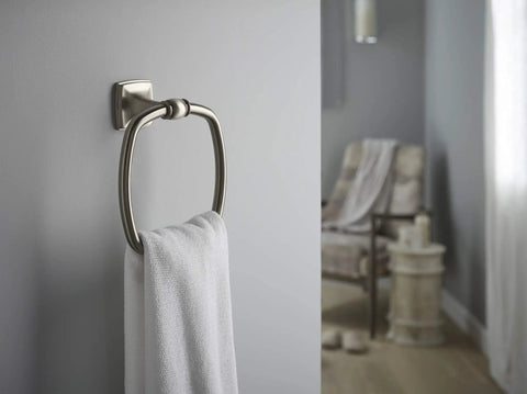 Grand Towel Ring In Vibrant Brushed Nickel, Transitional Style Bath Accessory displayed with towel against gray wall