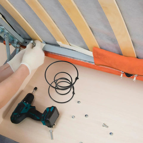 Heavy Duty Six Inch Sofa Spring Repair Kit installation process with black steel coil springs and a drill for couch restoration.