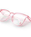 Protective Safety Glasses With Anti Fog Coating And Anti Scratch Lenses Unisex Fit For Men And Women Clear Polycarbonate Frames All Day Comfort Eye Protection In Pink, angled view, showing pink frame.