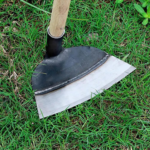 Heavy Duty Garden Hoe Tool with solid manganese steel blade on grass for weeding, soil loosening, and planting in backyard and farm