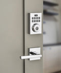 Contemporary Keypad SmartCode Deadbolt Lock With SmartKey Security and ZigBee Three Point Zero in polished chrome on door
