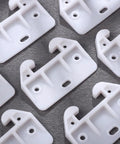 Slick White Plastic Drawer Track Guide Kit Packing 10 Pieces With Badass Durability And Hella Smooth Gliding Motion Top Shelf Center Mount Replacement For Any Furniture Fix close-up of durable white nylon drawer slide runners with mounting holes