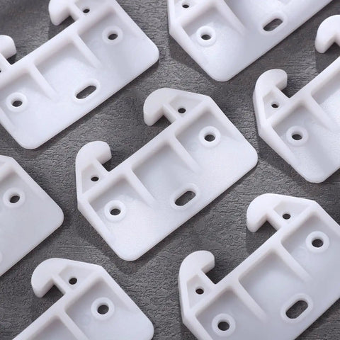 Slick White Plastic Drawer Track Guide Kit Packing 10 Pieces With Badass Durability And Hella Smooth Gliding Motion Top Shelf Center Mount Replacement For Any Furniture Fix close-up of durable white nylon drawer slide runners with mounting holes
