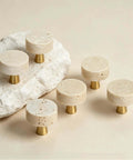 Set Of Six Natural Stone Cabinet Knobs And Round Marble Drawer Pulls With Solid Brass Base For Kitchen Cabinets And Bathroom Vanities Adding Swanky Charm That Is Built Like A Tank And Feels Dead Legit on a rock background.