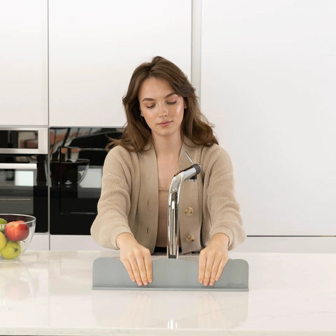 Silicone Sink Splash Guard With Non Slip Suction Base for Kitchen Island in use, gray, ergonomic design, keeps water off counters