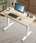 Electric Standing Desk with Solid Steel Frame And Smooth Height Adjustment For Home Office Gaming Setup That Rocks A Sleak Oak Finish to provide a modern workspace.