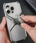 Person using KR03 EDC Pry Bar Multitool with Flathead and Phillips Driver, Bottle Opener on smartphone case, showcasing its functionality.