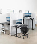 Vivo Black Height Adjustable Standing Desk 71x30 Inch Electric Sit Stand Workstation With Spacious Triple Monitor Riser Tray ergonomic setup in modern office.