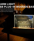 Acrylic Periodic Table With 83 Real Elements, Warm LED Light, USB Powered Wooden Display Stand glowing on desk