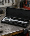 0-150mm Digital Caliper with Large LCD Display in black case on a workshop bench.