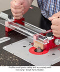 Zero Drama Small Parts Holder For Router Tables Delivers Big Time Accuracy And Rock Solid Safety For Your Shop With Heavy Duty Clamps And Precision Stop Pins For Tenons Rabbets And Dados in use with wood piece and router.