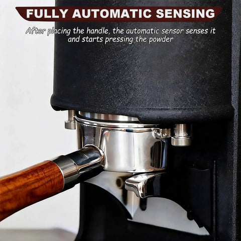 Electric Coffee Tamper With Stainless Steel Dock And Custom Pressure Tuner Yields Tight Espresso Pulls Between Five To Thirty Kilograms showing automatic sensing with portafilter and wooden handle.